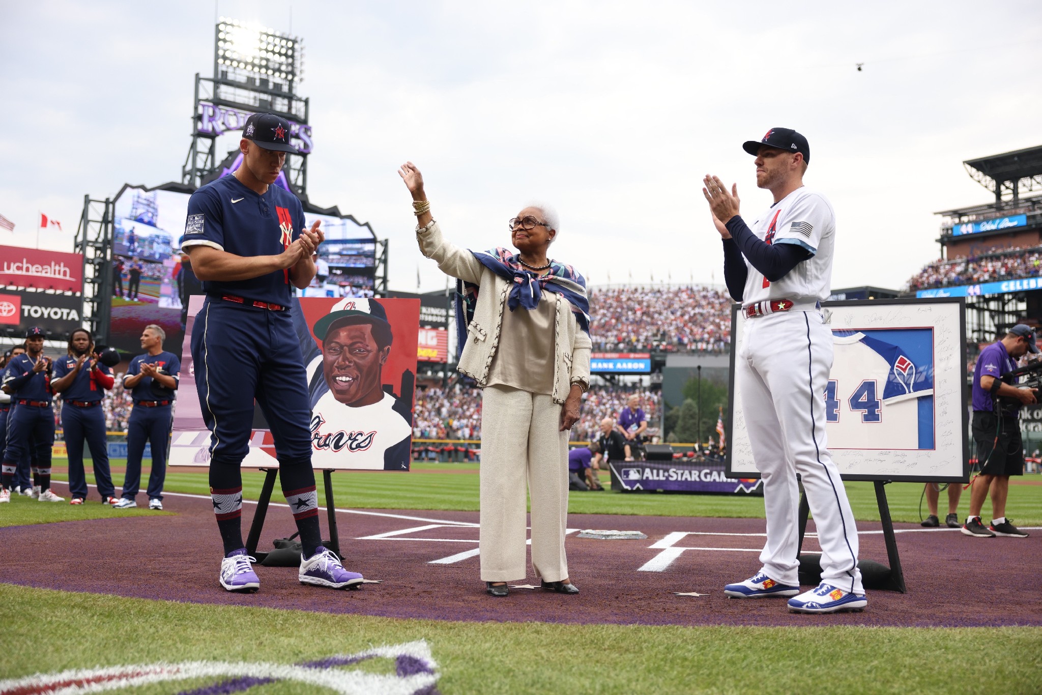 Aaron Judge and Freddie Freeman honoring Hank Aaron during MLB All-Star game festivities with custom framed memorabilia by 5280 Custom Framing
