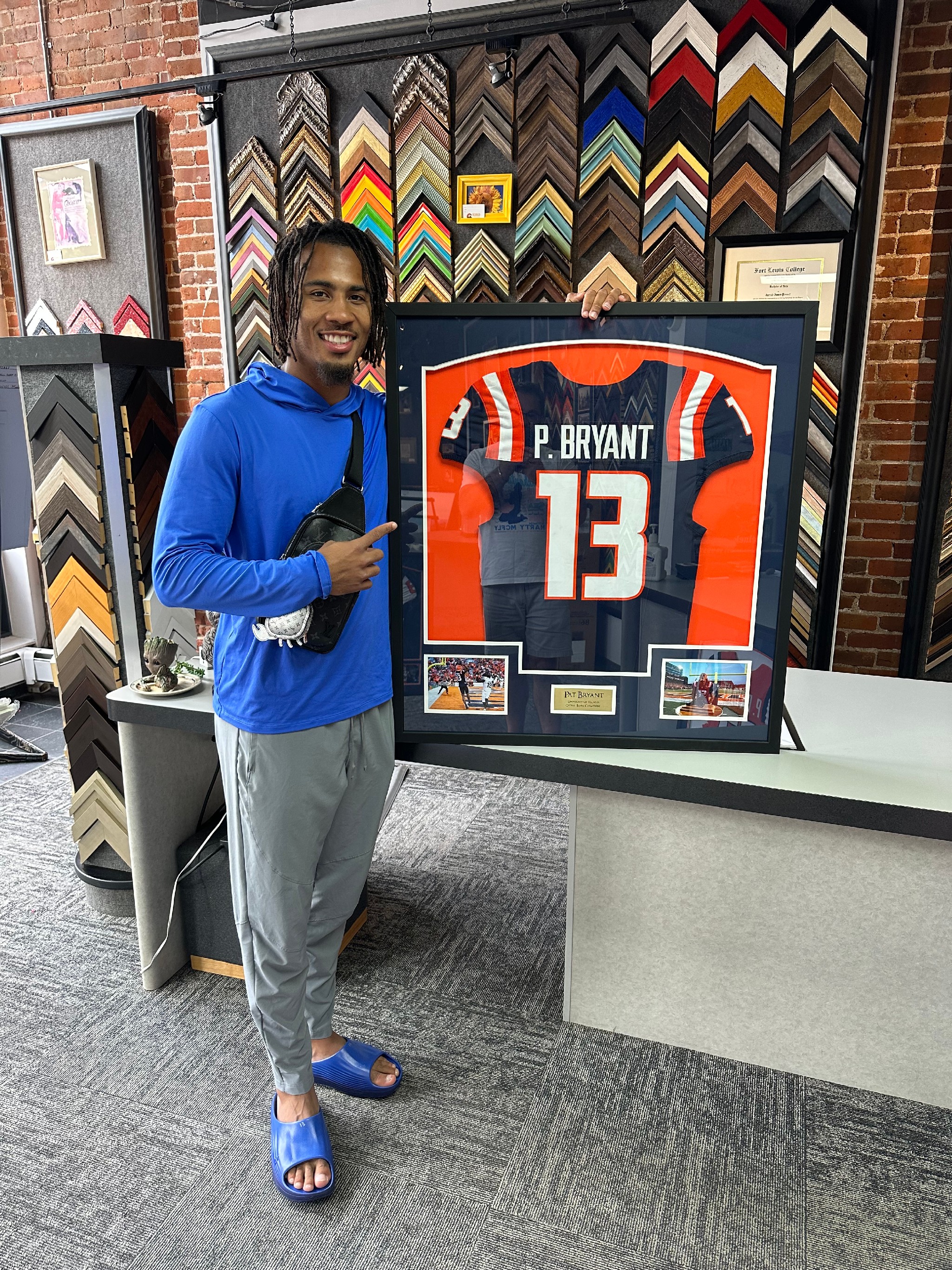 Wide receiver Pat Bryant with his custom framed football jersey