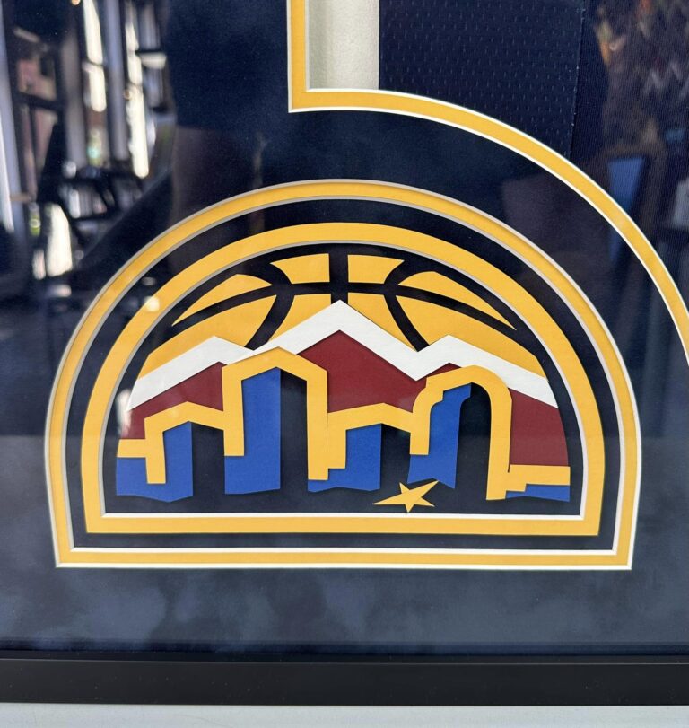 Custom Denver Nuggets skyline logo mat cut for a sports jersey display