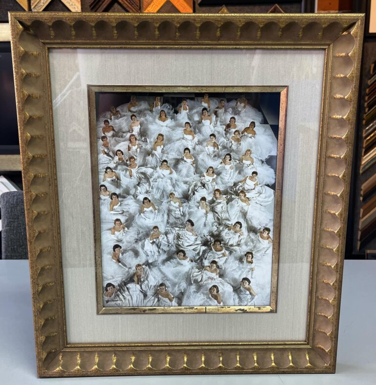Custom picture framing featuring a vintage bridal portrait with elegant gold frame
