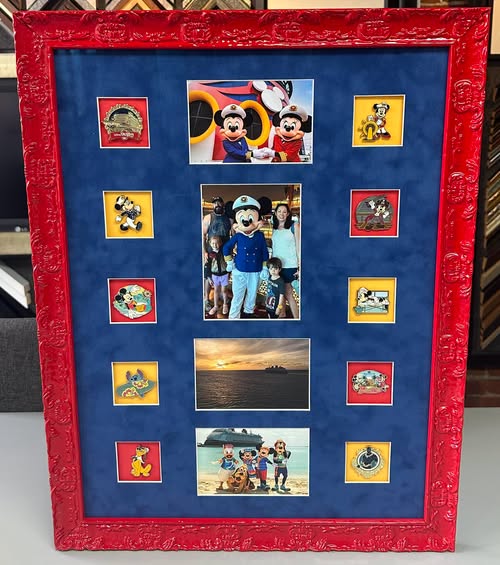 Custom framed Disney vacation photo collage with blue matting and ornate red frame