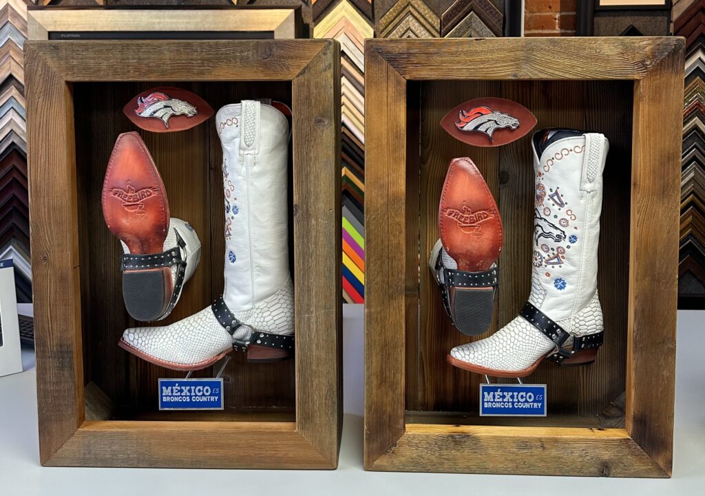 Custom shadowbox displays for Denver Broncos cowboy boots and sports memorabilia