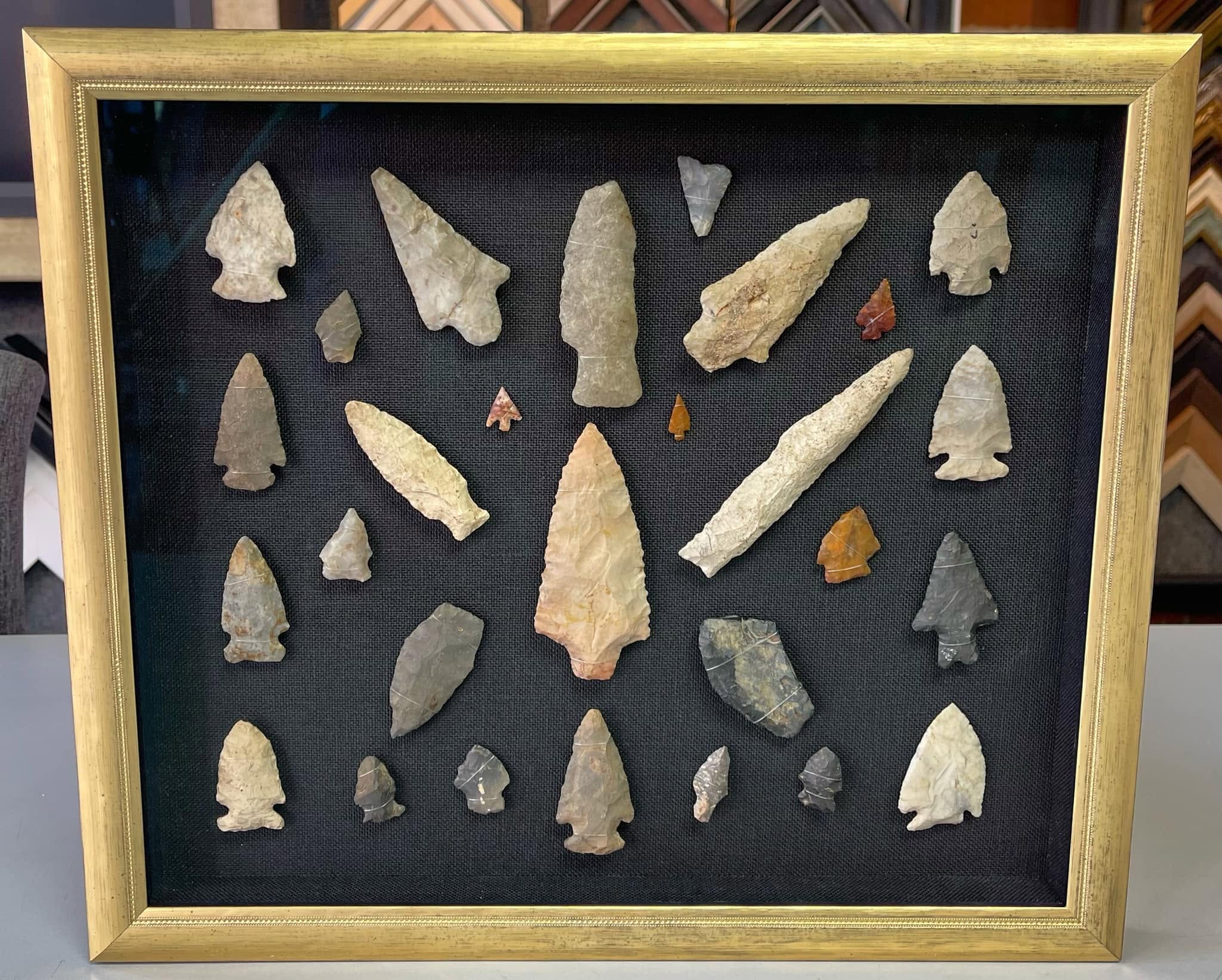 Custom shadowbox framing for Native American arrowhead collection and stone artifacts