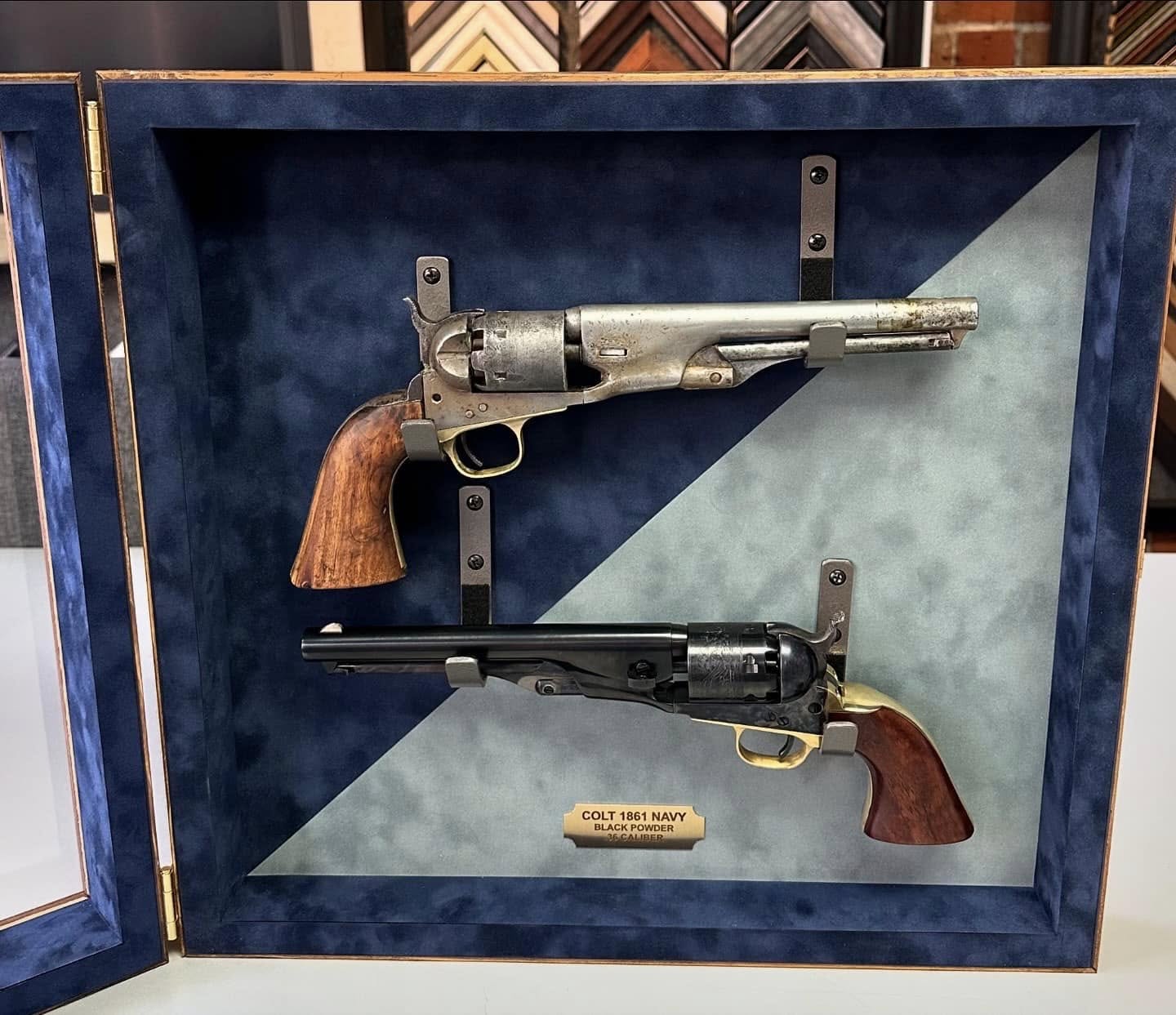 Custom shadowbox display case for antique revolvers and collectible firearms