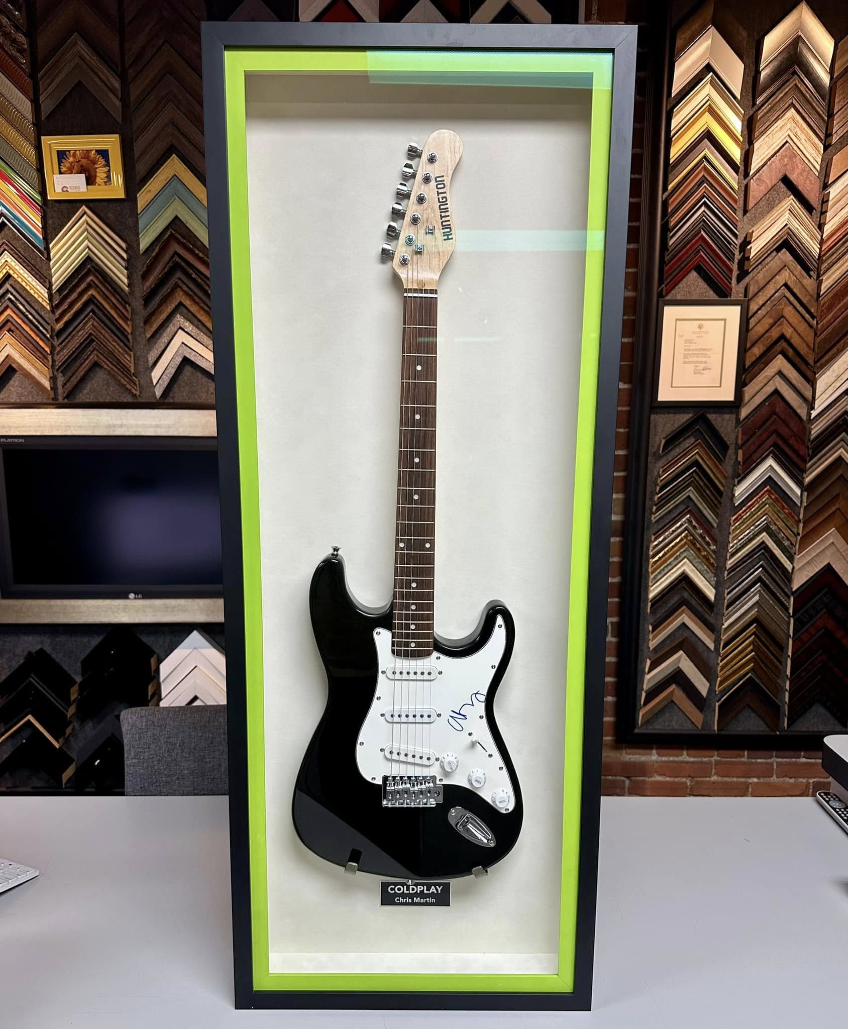 Custom guitar display case framing for signed electric guitar memorabilia
