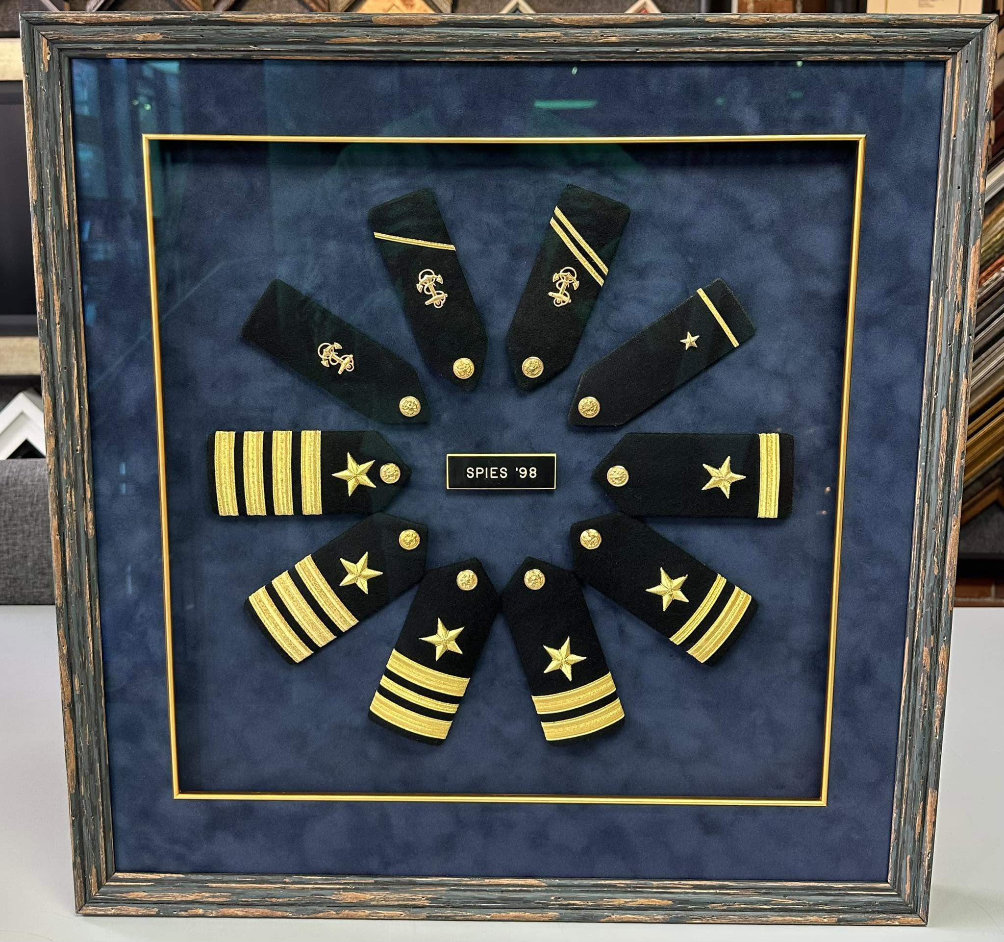 Custom military shadowbox framing for naval rank insignia and service memorabilia
